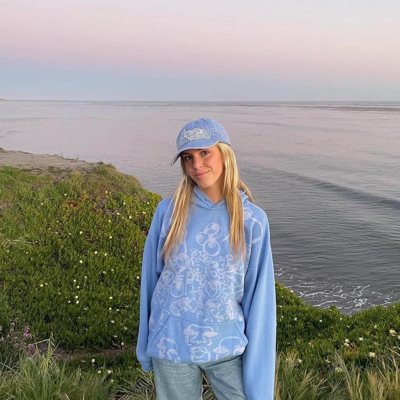 Abstract faces and unique print pastel blue hoodie