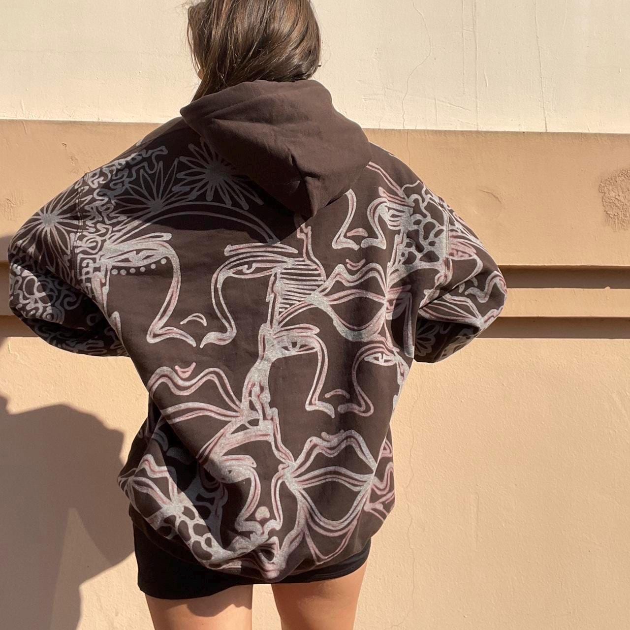 . Abstract faces, spotted mushroom clouds, and geometric cozy hoodie in dark chocolate brown and cream