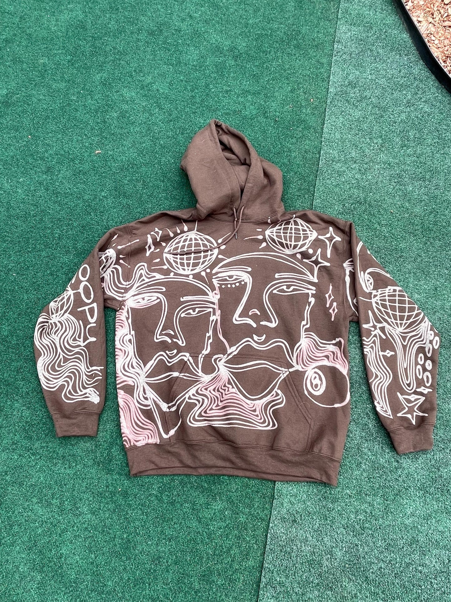 Abstract faces, disco ball, stars, and trippy patterns festival style style hoodie in brown and cream