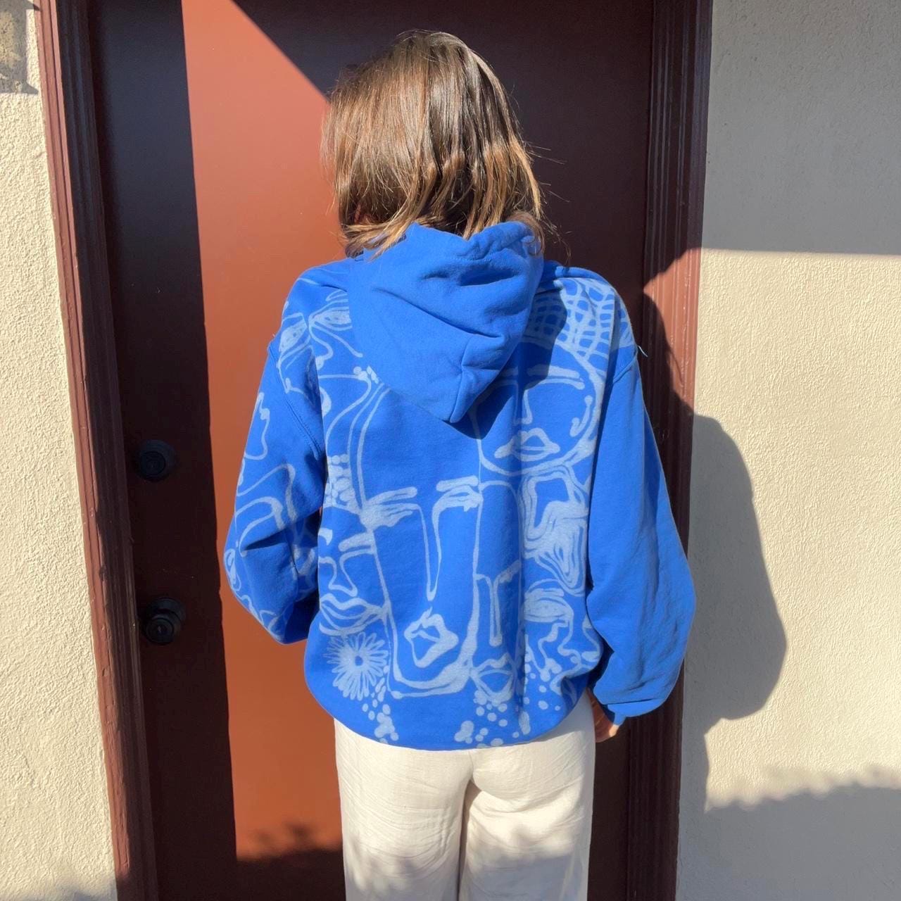 Crazy unique abstract faces oversized hoodie in royal blue