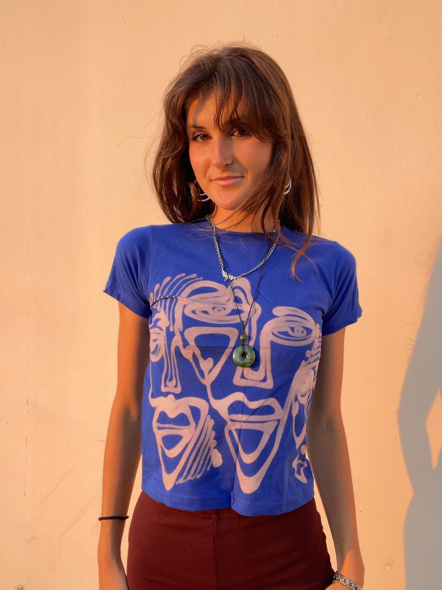Various faces baby tees