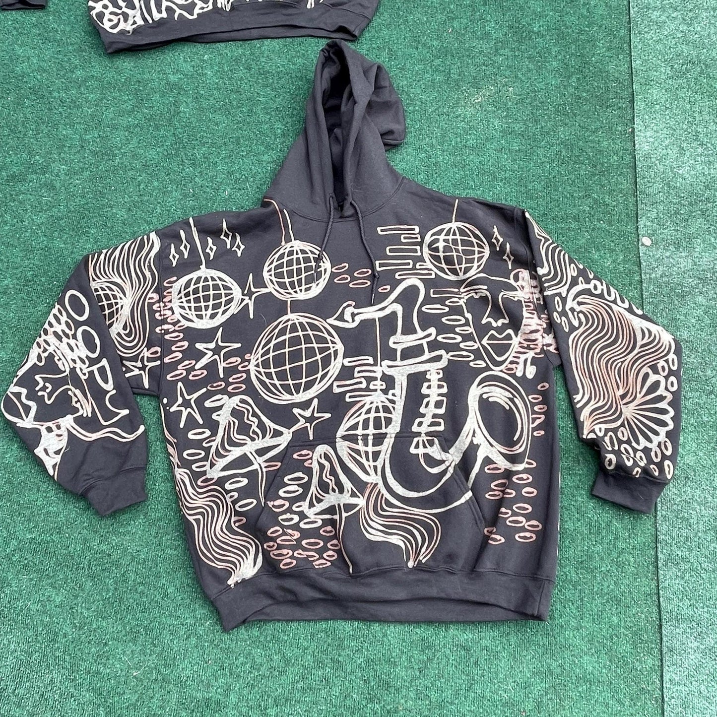 Abstract faces, disco ball, stars, and trippy patterns festival style style hoodie in brown and cream