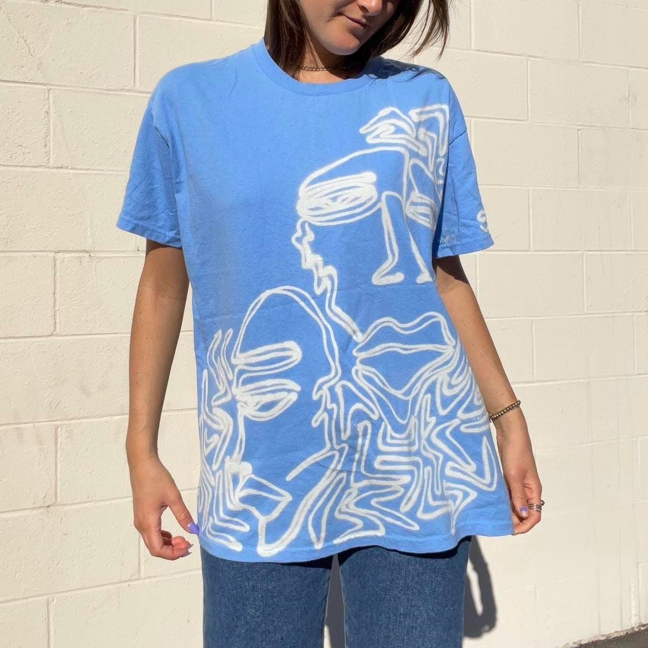 Pastel blue faces graphic oversized tee
