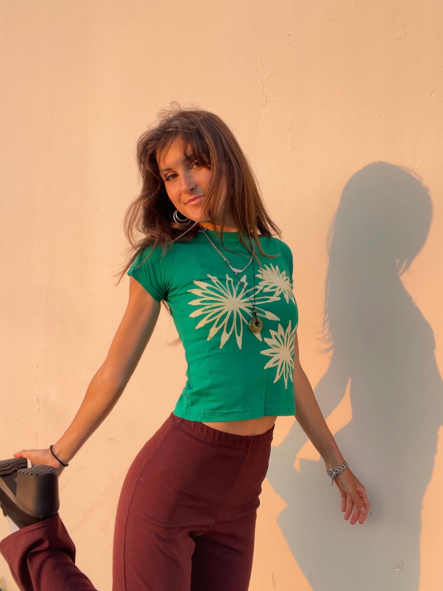 Various handmade flower baby tees