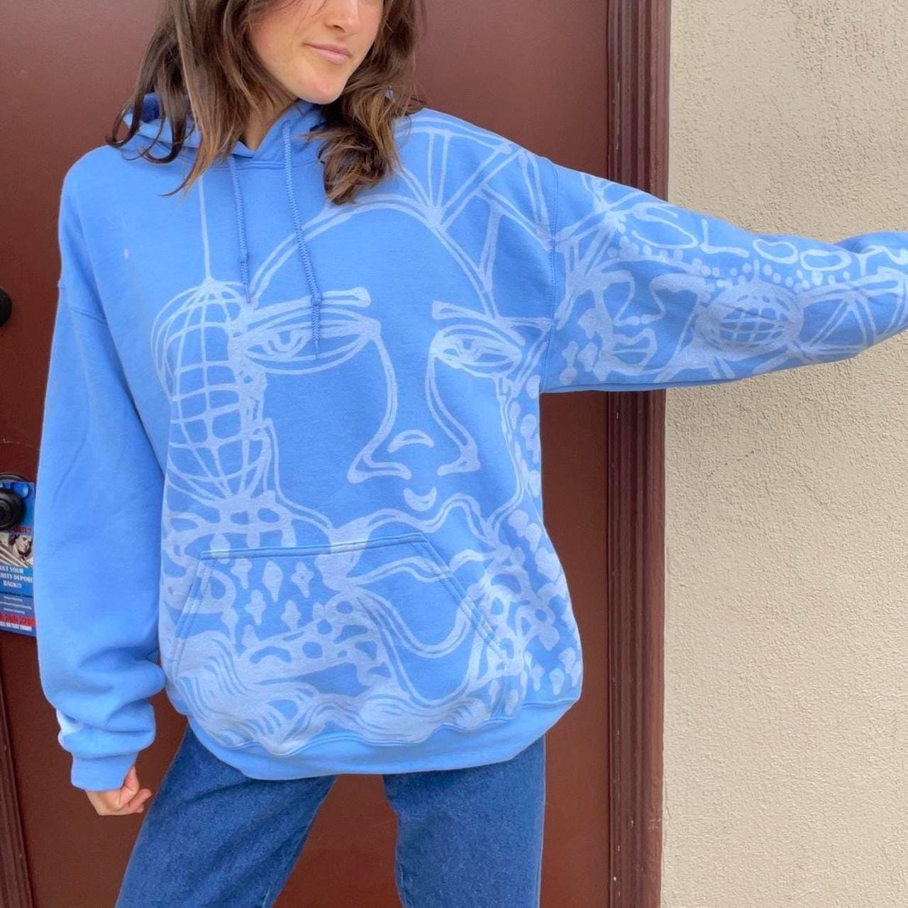 Abstract faces and unique print pastel blue hoodie
