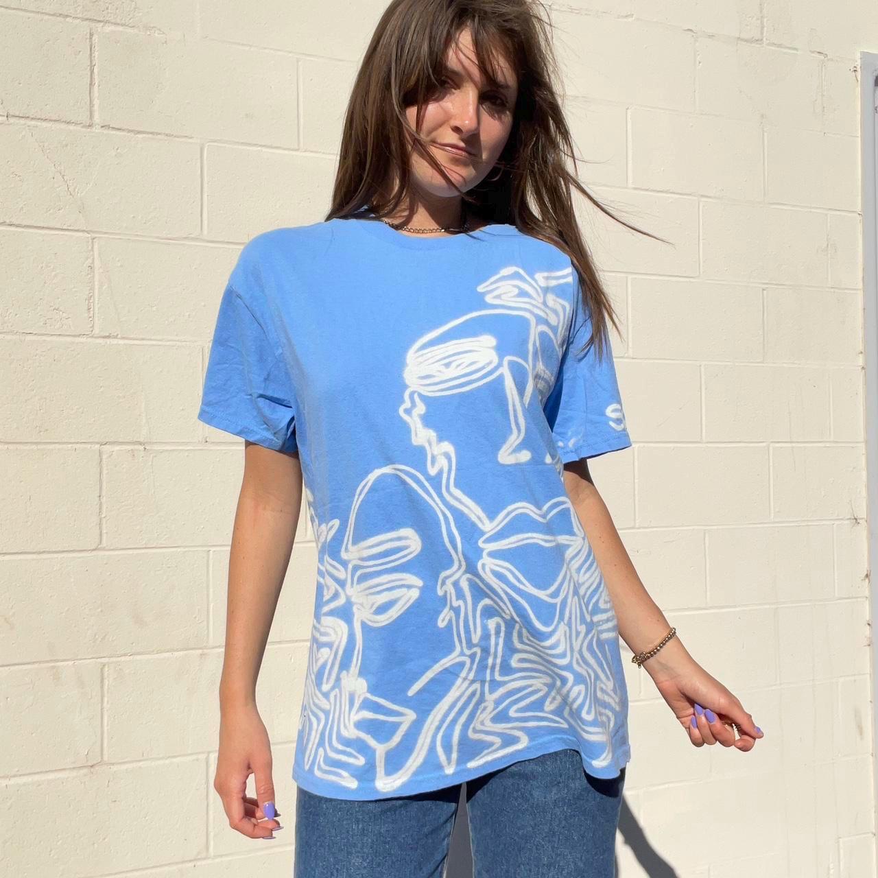 Pastel blue faces graphic oversized tee
