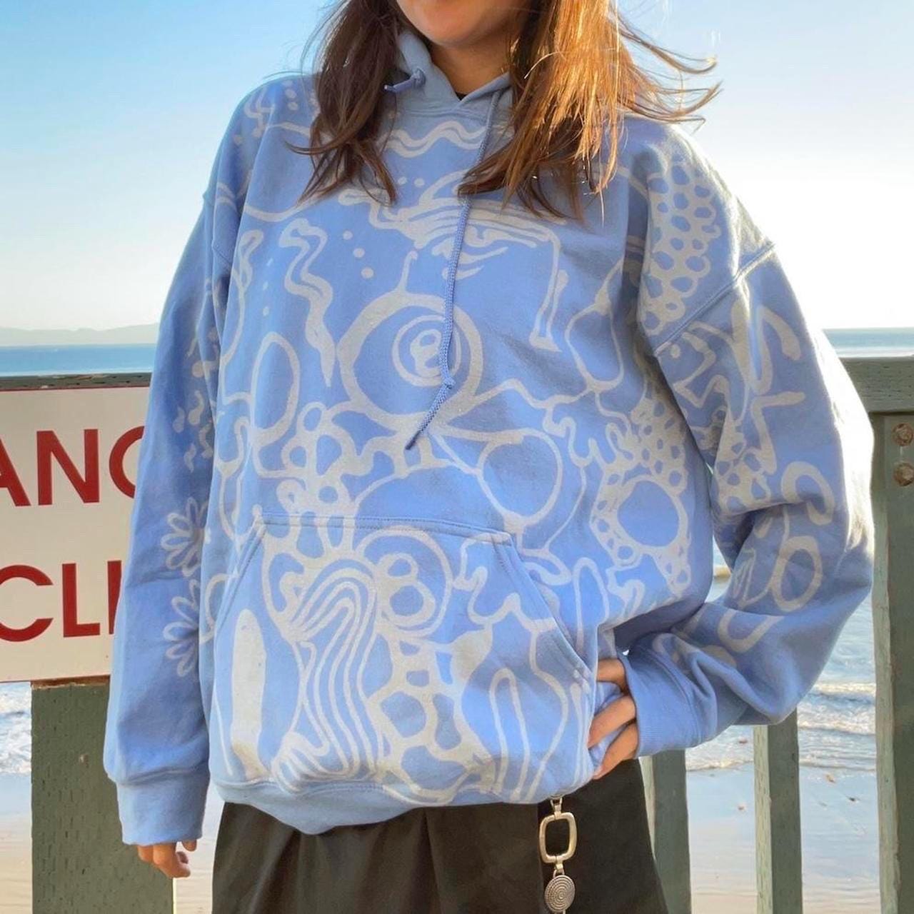 Pastel blue handpainted abstract faces and geometric patterns graphic hoodie