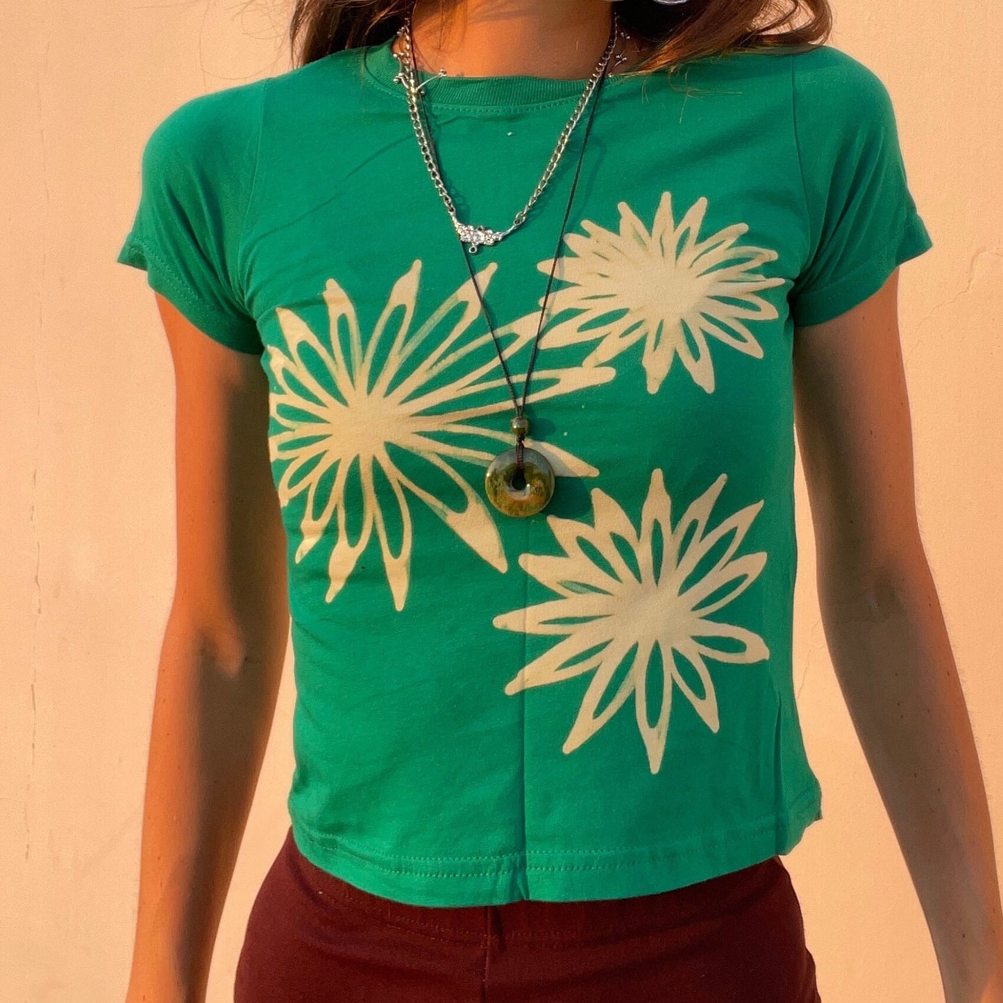 Various handmade flower baby tees