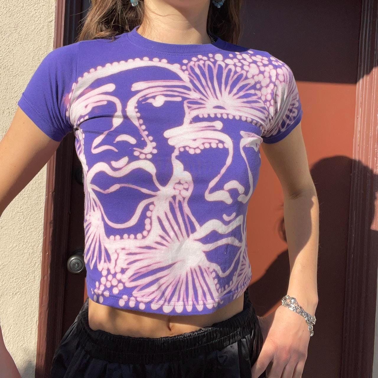 Funky floral daisies and abstract faces baby tee