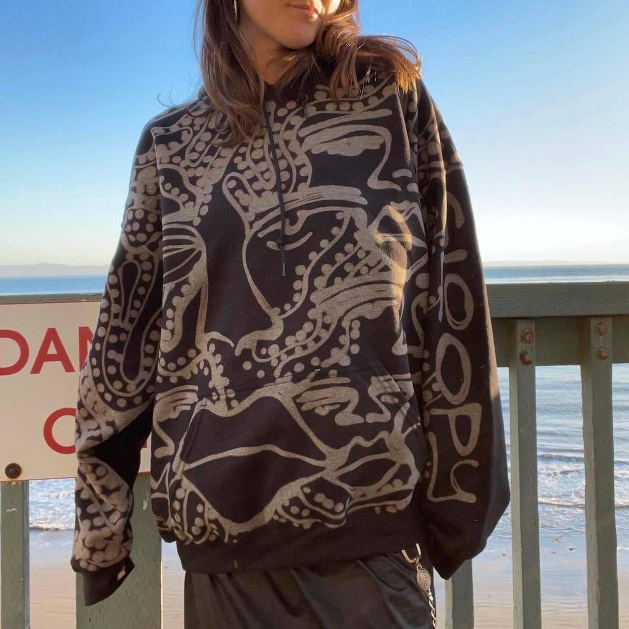 Abstract faces and geometric style spotted and striped groovy hoodie in black and grey