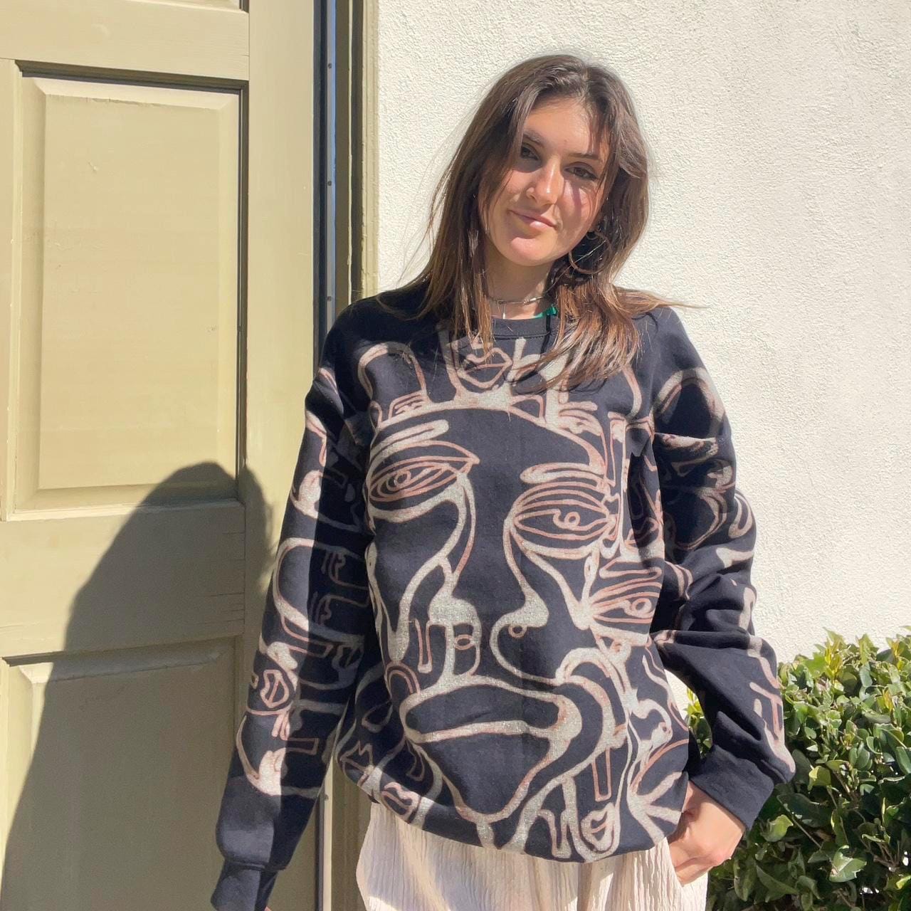 Abstract faces crewneck