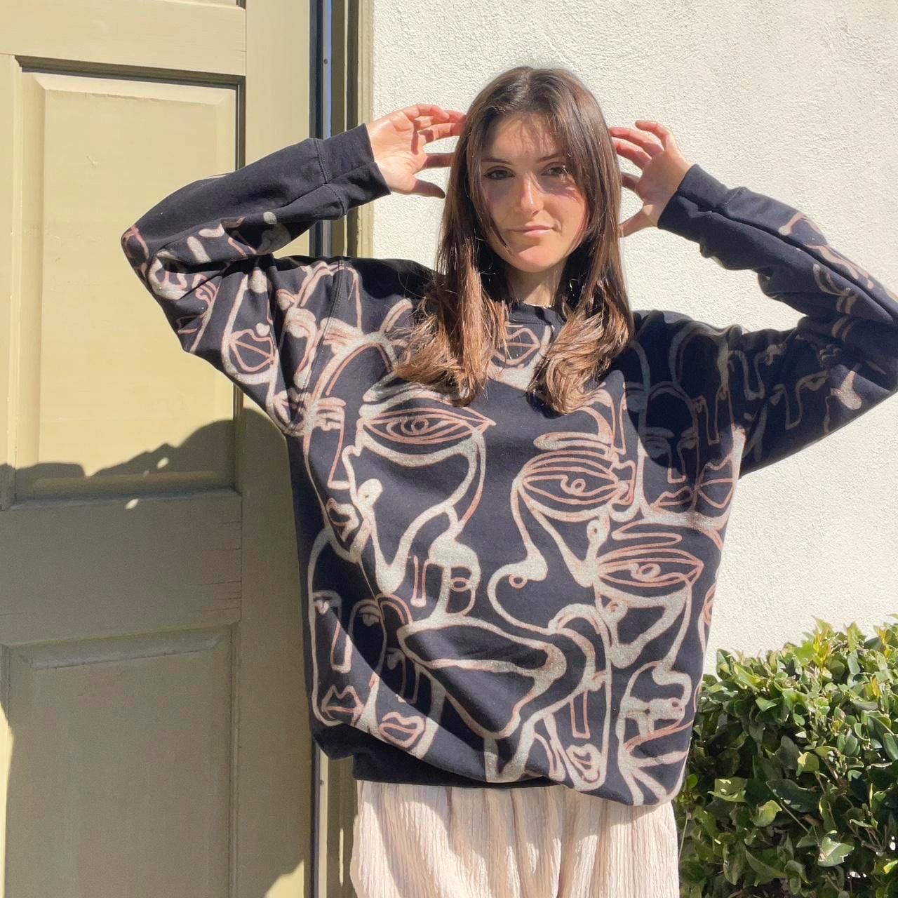 Abstract faces crewneck